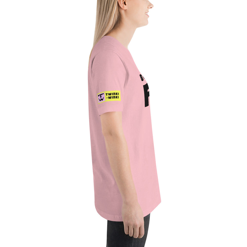 Young woman right side wearing cotton slogan tee in light pink color with slogan Born To Be Fab in black letters on front.