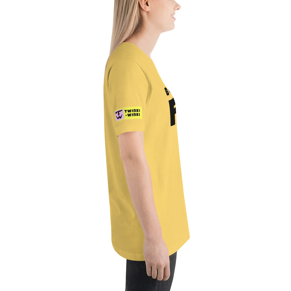 Young woman right side wearing cotton slogan tee in yellow color with slogan Born To Be Fab in black letters on front.