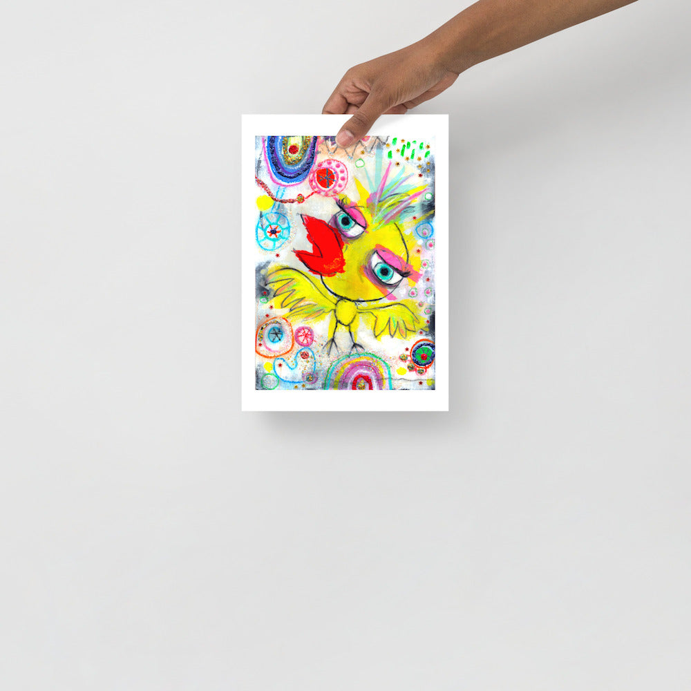 Colorful happy fine art print of a yellow bird singing on vibrant background hand held against wall to show size.