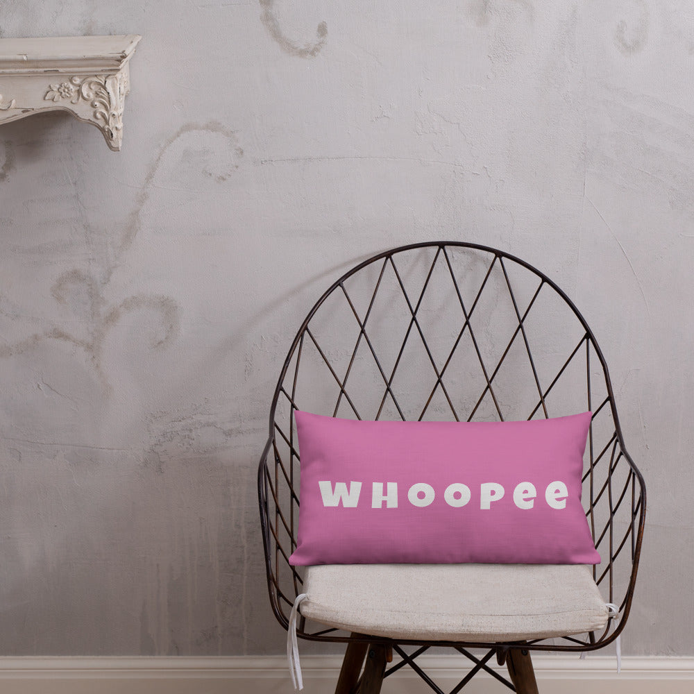 Vibrant, cheerful, and playful style accent pillow on modern chair with a fun Whoopee slogan in platinum letters on pink.