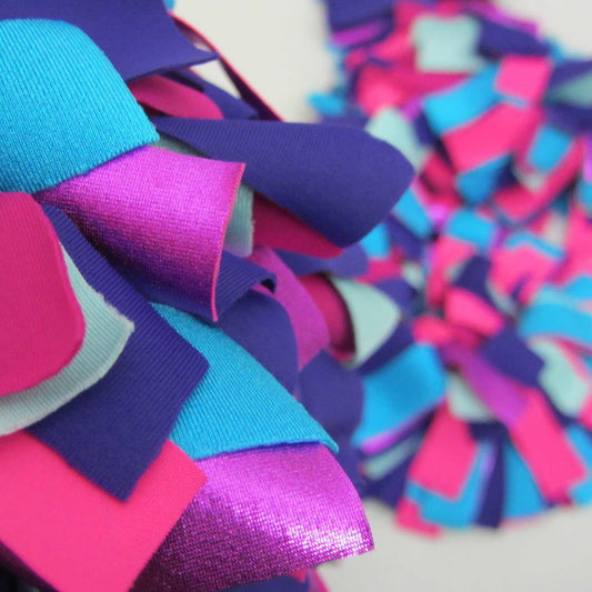 Detail of colorful and stylish soft lush fashion boa scarf in aqua, purple, pink colors limited edition Twinki-Winki view 1.