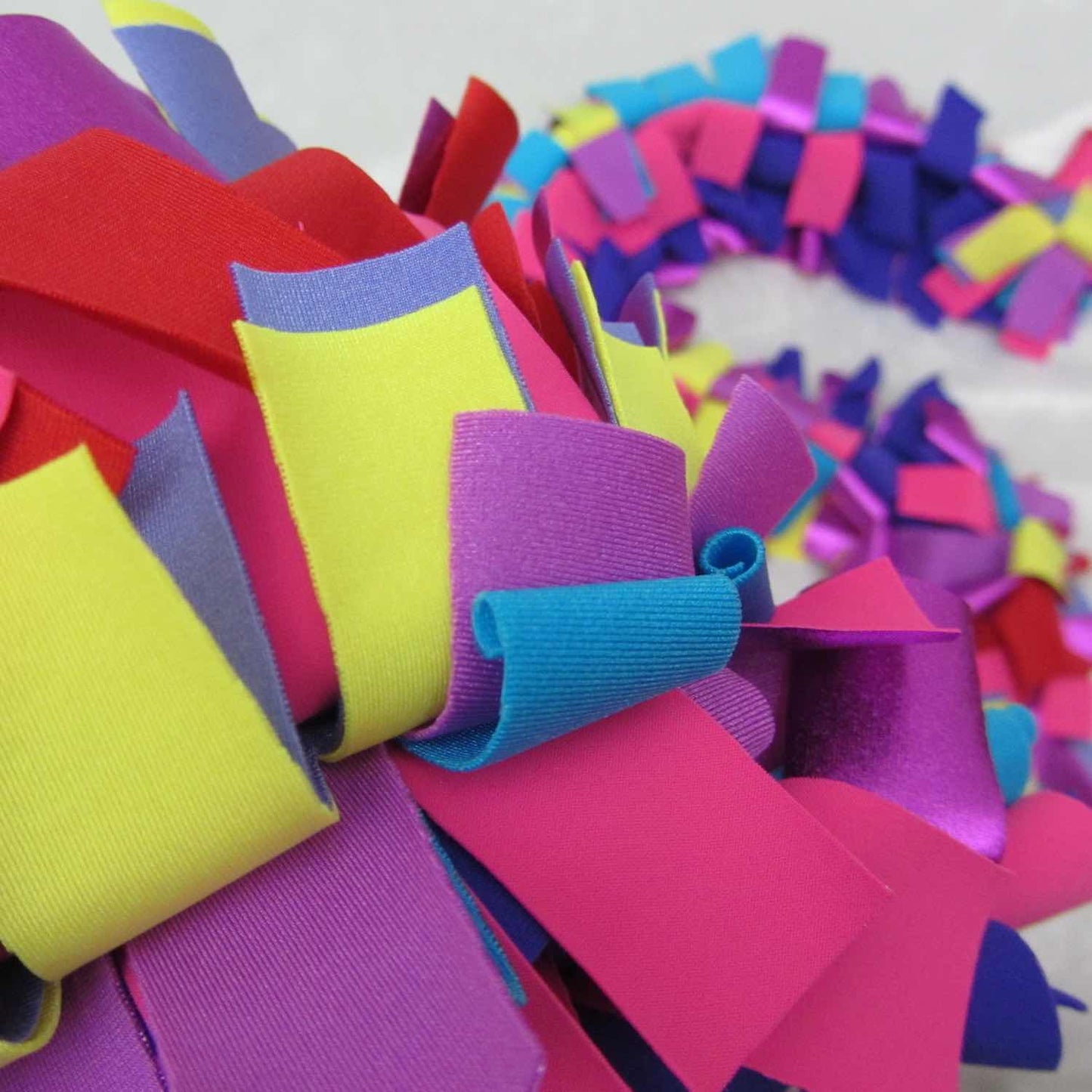 Detail of colorful and stylish soft lush fashion boa scarf in yellow, purple, pink colors limited edition Twinki-Winki view 2.