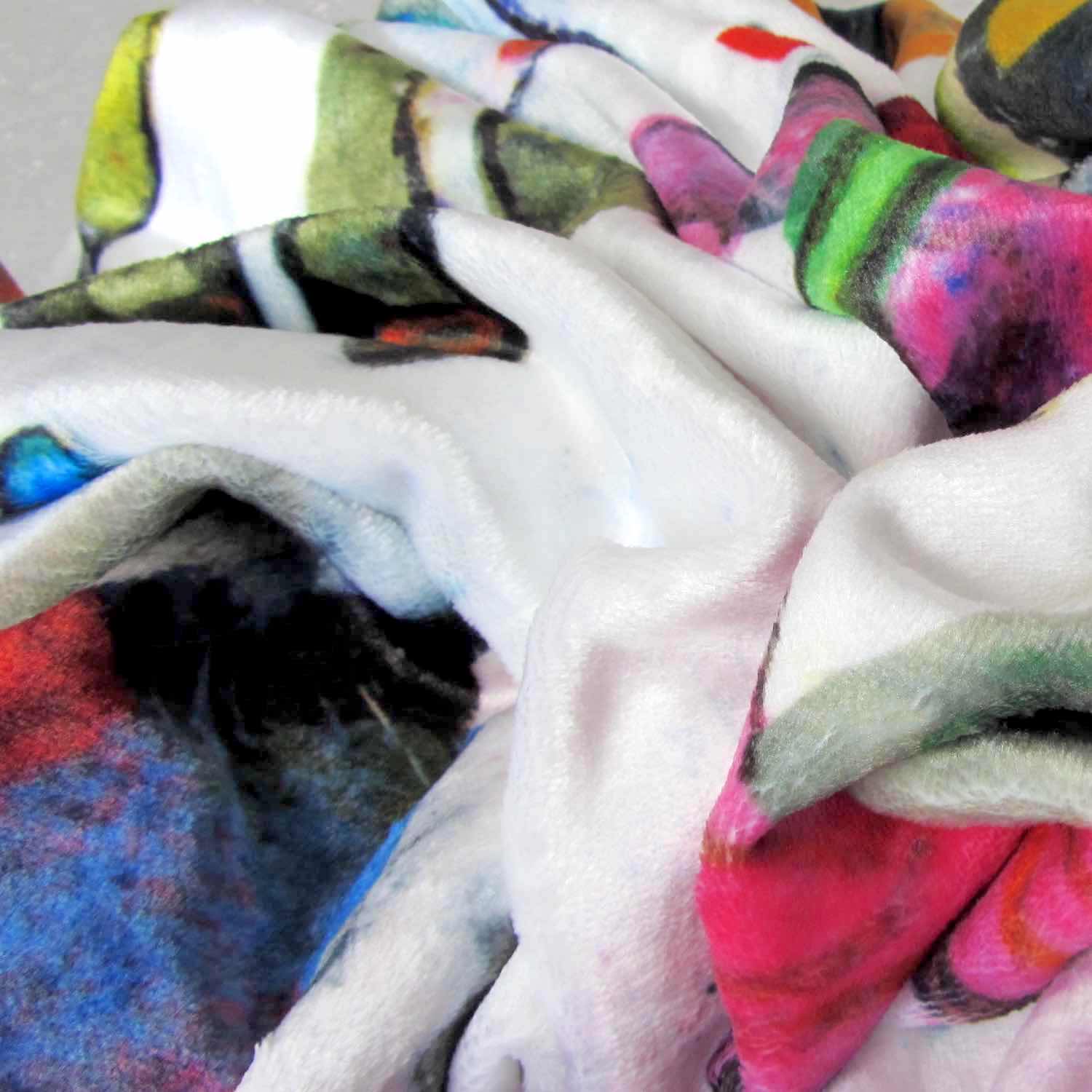 Close-up of soft feel cozy and stylish graphic throw blanket with happy multicolor Fab Ladies print in vibrant colors.