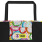 Inside pocket with multicolor Frosted Cookies print and black interior lining of graphic tote bag.
