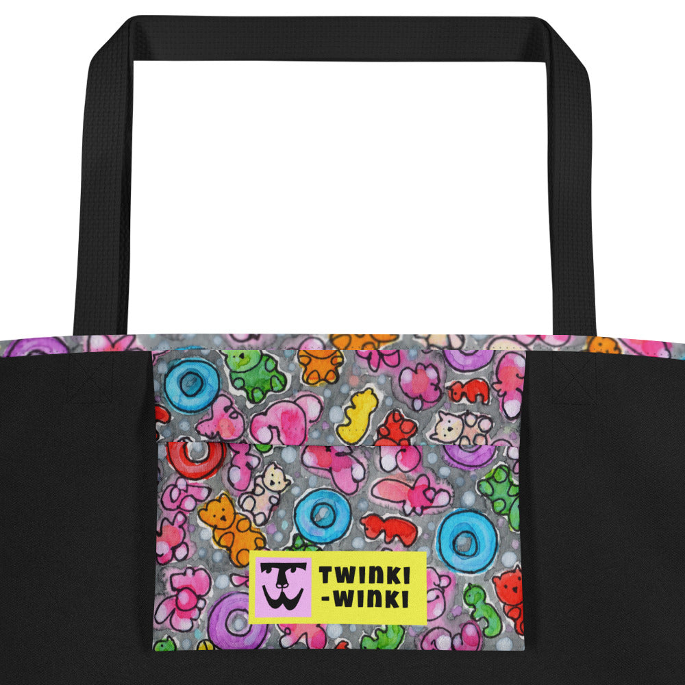 Inside pocket with multicolor Popcornfroops print and black interior lining of graphic tote bag.