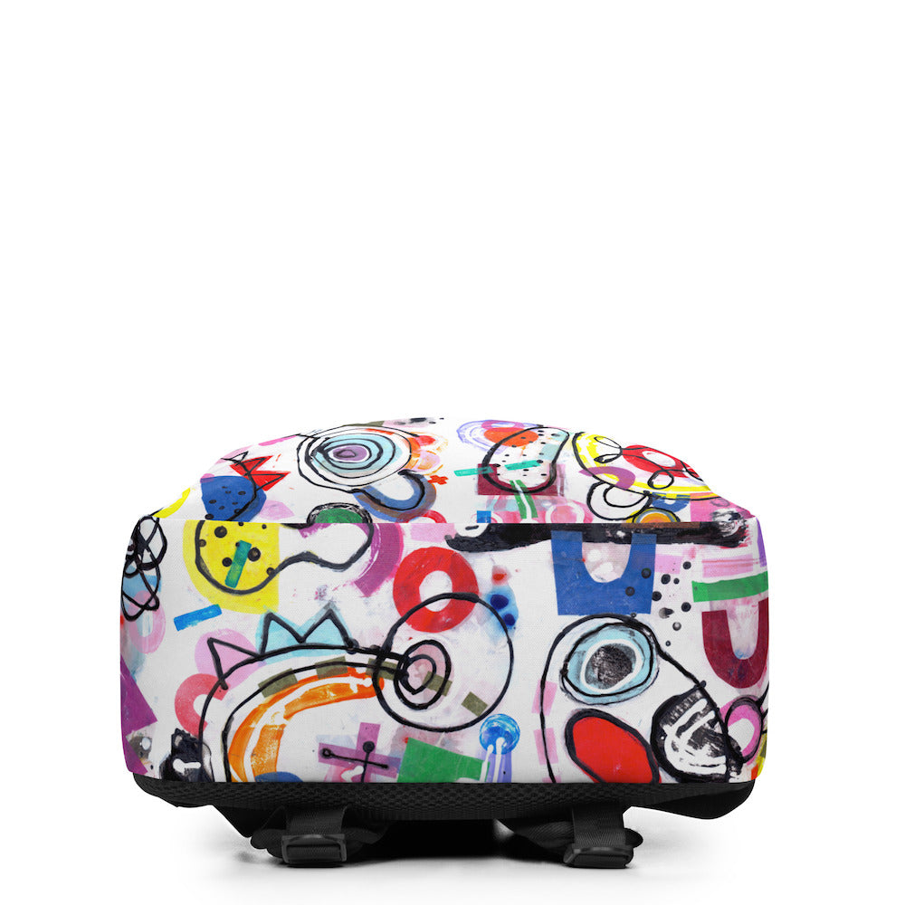 Graphic minimal design city style backpack with fun multicolor Treasure Map print and black soft mesh padded back, bottom view.