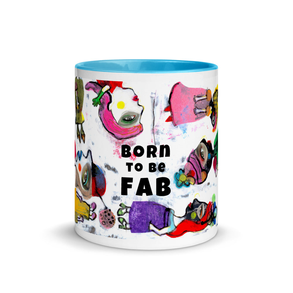 Graphic coffee mug with slogan Born To Be Fab and blue accent color on rim, handle and interior. Colorful Fab Ladies design, front view.