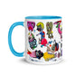  Graphic coffee mug with slogan Born To Be Fab and blue accent color on rim, handle and interior. Colorful Fab Ladies design, left handle view.