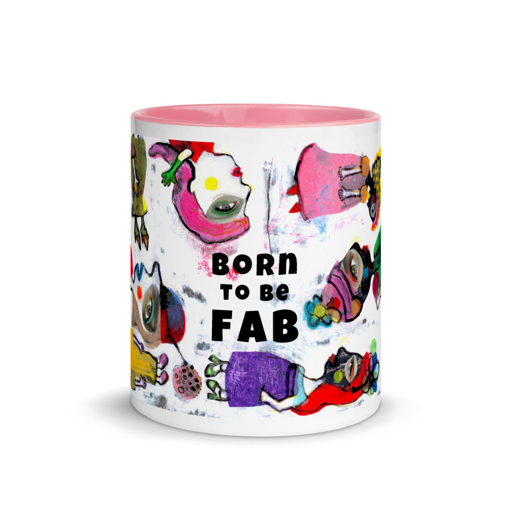 Graphic coffee mug with slogan Born To Be Fab and pink accent color on rim, handle and interior. Colorful Fab Ladies design, front view.