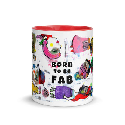Graphic coffee mug with slogan Born To Be Fab and yellow accent color on rim, handle and interior. Colorful Fab Ladies design, front view.