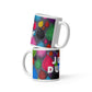 Two stacked colorful ceramic 11 ounce coffee mugs with quirky slogan Just Ducky in white letters on Dripdrop design.