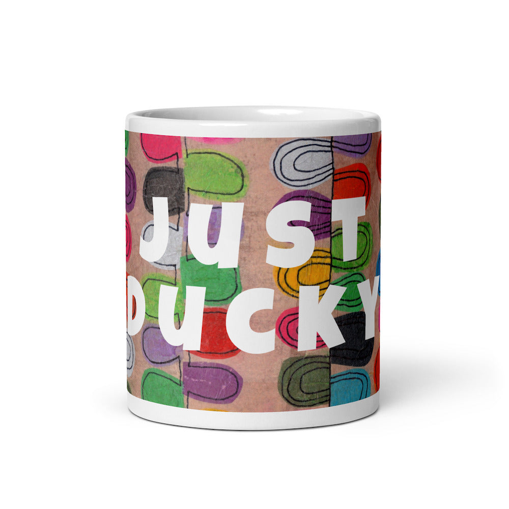 Colorful ceramic coffee mug with quirky slogan Just Ducky in white letters on Flipflop design, front view of 11 ounce mug size.