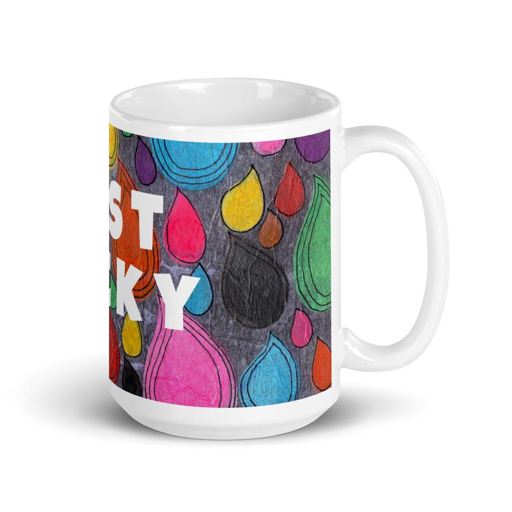 Big colorful ceramic coffee mug with quirky slogan Just Ducky in white letters on Dripdrop design, right handle view of 15 ounce mug size.