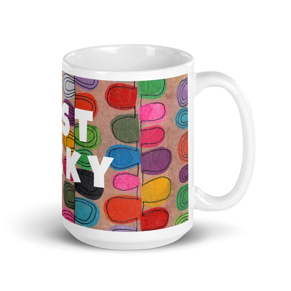 Big colorful ceramic coffee mug with quirky slogan Just Ducky in white letters on Flipflop design, right handle view of 15 ounce mug size.