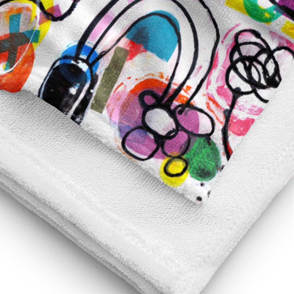 Stylish soft chic beach towel with bold multicolor Treasure Map print in a vibrant, cheerful, and playful style showing fabric detail.