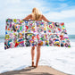 Stylish chic beach towel with bold multicolor Treasure Map print in a cheerful and playful style. Shown horizontally and held by model.