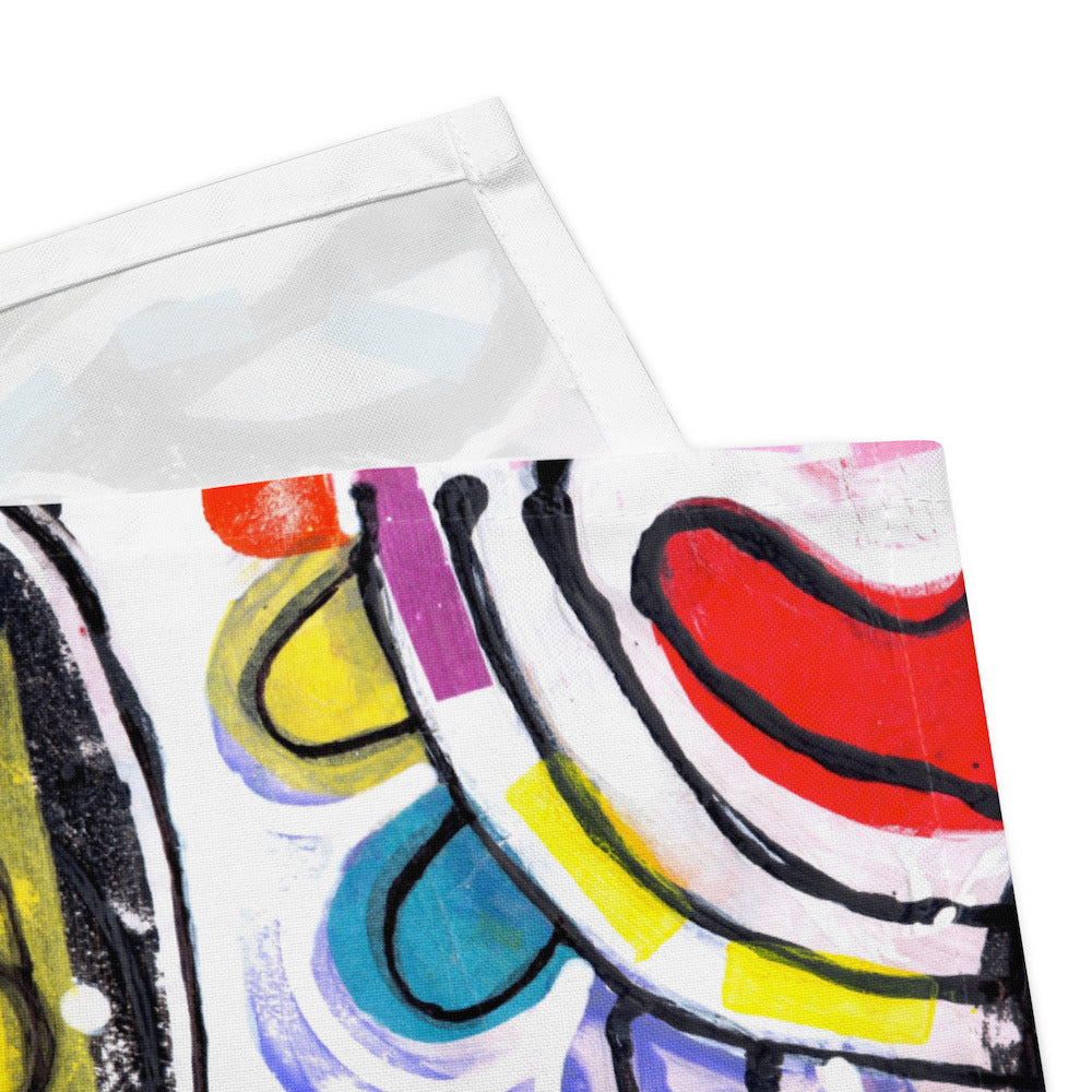 Arty graphic napkin with multicolor Treasure Map print in a vibrant, cheerful, and playful style. Detail of hem stitching on Design 2 of 4.