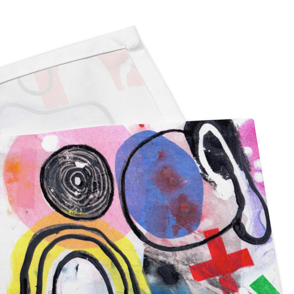 Arty graphic napkin with multicolor Treasure Map print in a vibrant, cheerful, and playful style. Detail of hem stitching on Design 3 of 4.