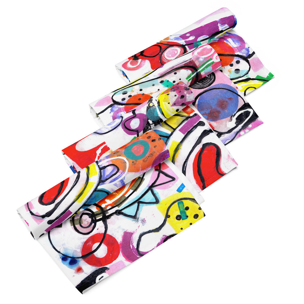 Arty graphic napkin set of four rolled and stacked together with happy multicolor Treasure Map print in a vibrant, cheerful, and playful style.
