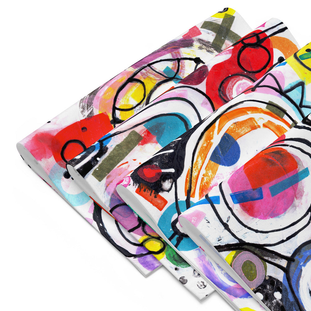 Arty graphic placemat set of four folded together with happy multicolor Treasure Map print in a vibrant, cheerful, and playful style.