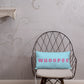 Vibrant, cheerful, and playful style accent pillow on modern chair with a fun Whoopee slogan in pink letters on cyan.