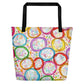 Big sturdy graphic tote bag with multicolor Frosted Cookies print on front and black straps.