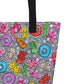 Close-up of black shoulder strap on multicolor Popcornfroops print on front of graphic tote bag.