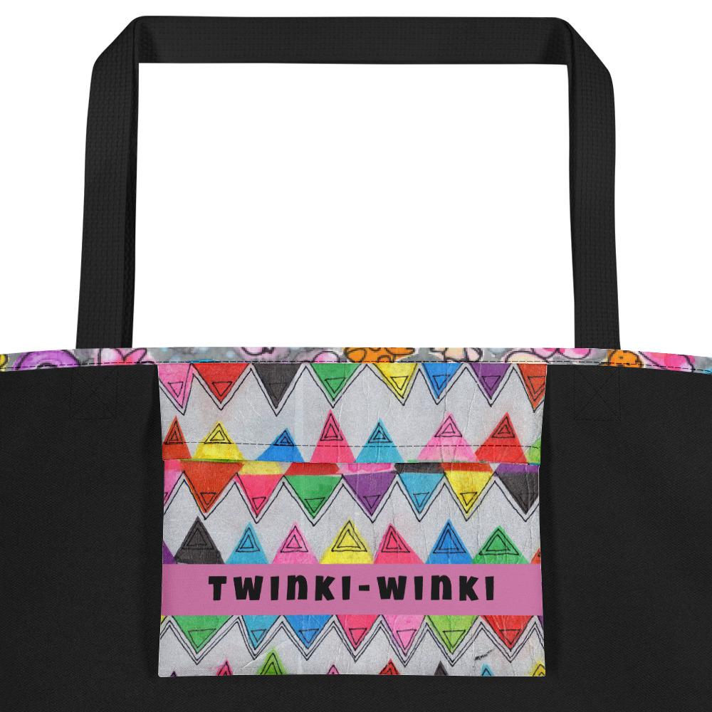 Inside pocket with multicolor Zigzag print and black interior lining of graphic tote bag.
