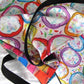 Big sturdy graphic tote bag with two multicolor prints in Frosted Cookies-Flipflop design with matching laptop case.