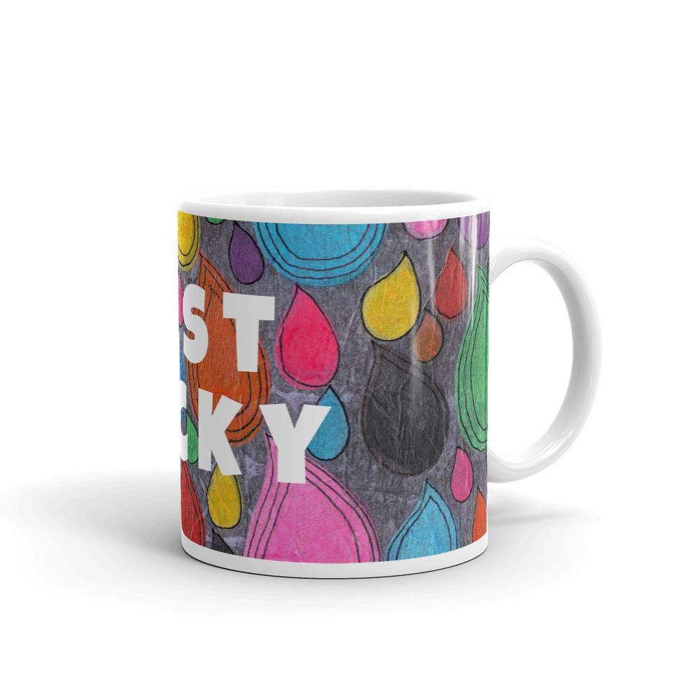 Colorful ceramic coffee mug with quirky slogan Just Ducky in white letters on Dripdrop design, right handle view of 11 ounce mug size.
