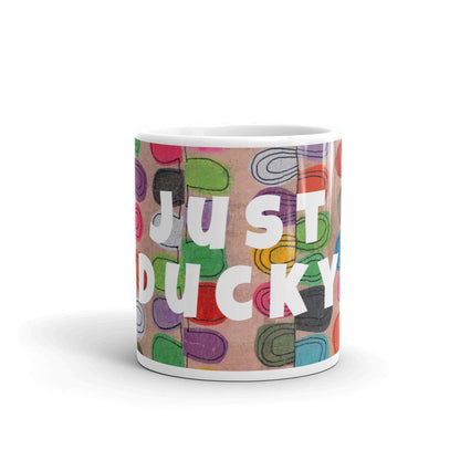 Colorful ceramic coffee mug with quirky slogan Just Ducky in white letters on Flipflop design, front view of 11 ounce mug size.