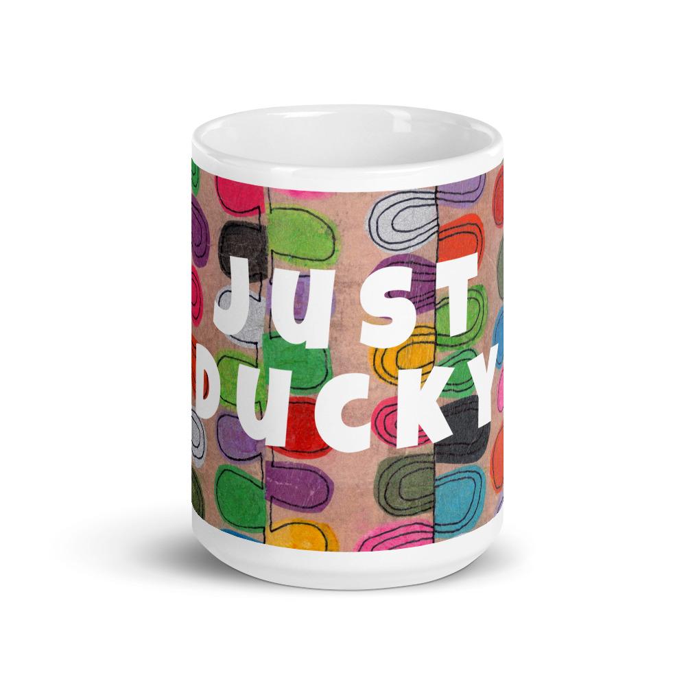 Big colorful ceramic coffee mug with quirky slogan Just Ducky in white letters on Flipflop design, front view of 15 ounce mug size.