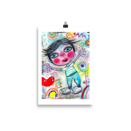 Colorful happy fine art print of a little boy surprised and excited on vibrant background hanging on wall from a binder clip.