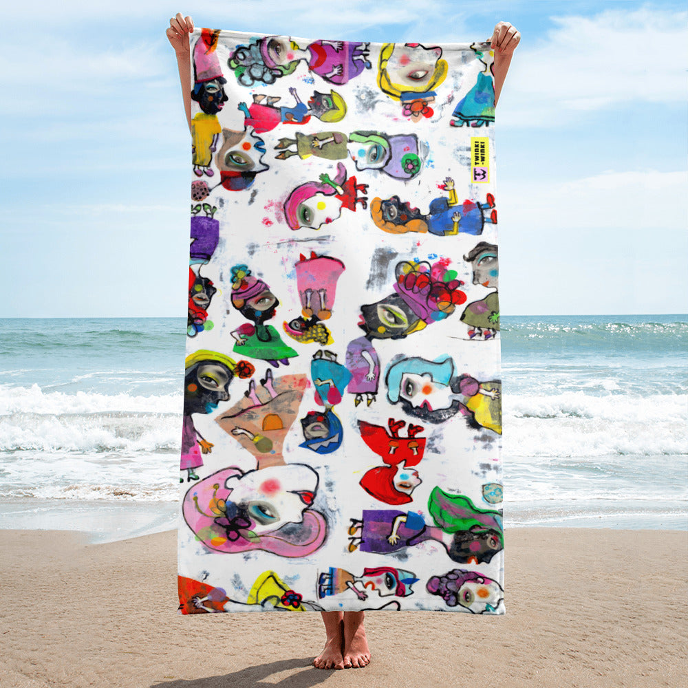 Stylish chic beach towel with bold multicolor Fab Ladies print in a cheerful and playful style. Shown vertically and held by model.