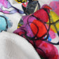 Close-up of stylish soft chic beach towel with bold multicolor Fab Ladies print in vibrant colors view 1.