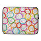 Sturdy graphic laptop case with rainbow-inspired multicolor print in Frosted Cookies design and black zipper binding, 15 inch size.