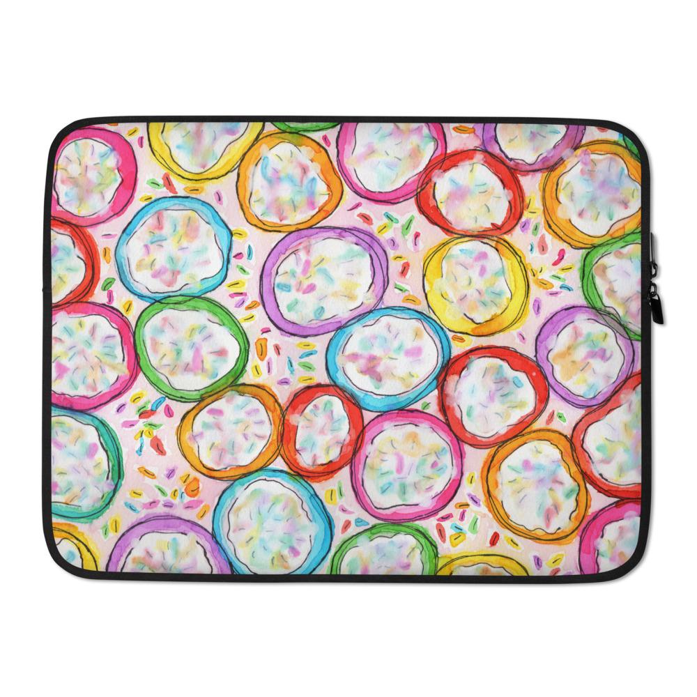 Sturdy graphic laptop case with rainbow-inspired multicolor print in Frosted Cookies design and black zipper binding, 15 inch size.