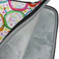Graphic laptop case with rainbow-inspired multicolor print in Frosted Cookies. Detail of soft furry lining in gray color.