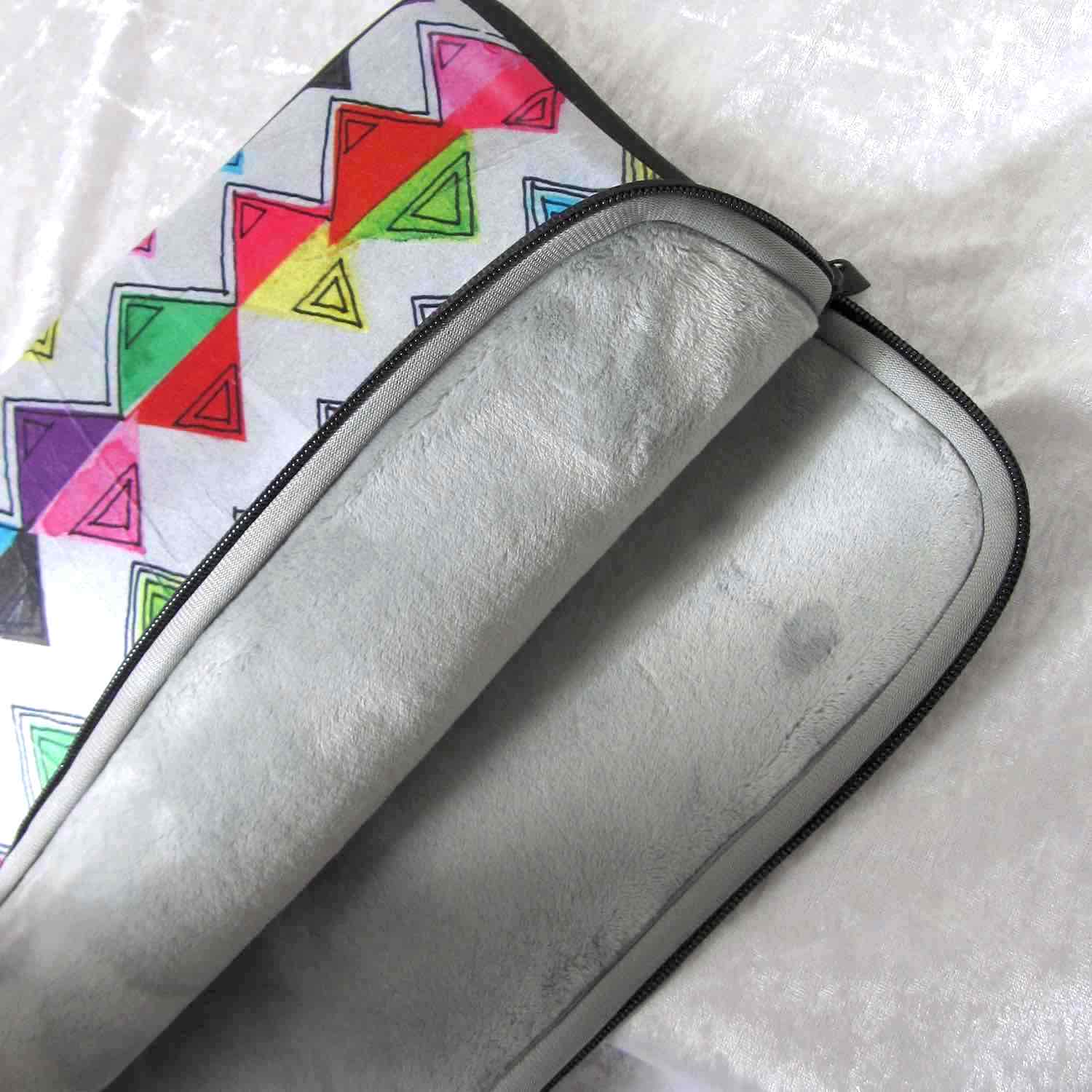 Close-up of soft furry lining in gray color of graphic laptop case with rainbow-inspired multicolor print in Zigzag.
