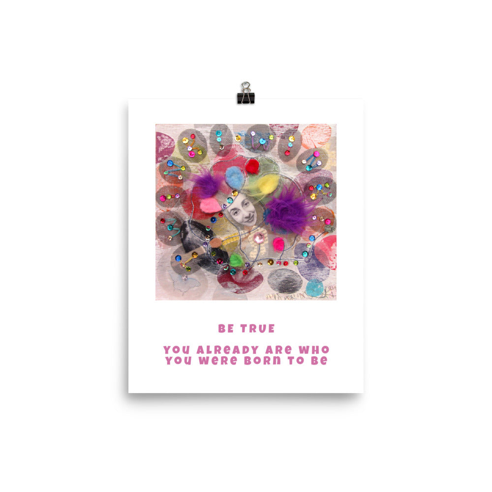 Fine art print Be True hanging with a binder clip. Alex Mitchell’s happy face surrounded by colorful shapes and textures.