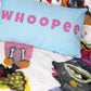 Soft cozy graphic throw blanket with happy multicolor Fab Ladies print in vibrant colors with matching Whoopee pillow.