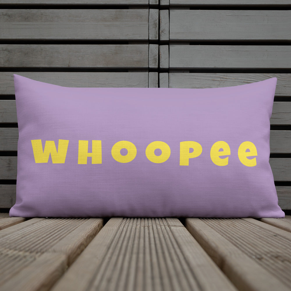 Vibrant, cheerful, and playful style accent pillow on wood deck with a fun Whoopee slogan in yellow letters on violet.