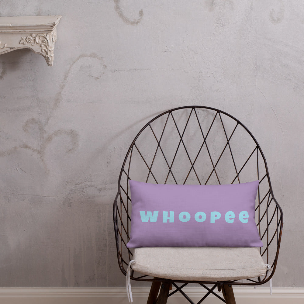 Vibrant, cheerful, and playful style accent pillow on modern chair with a fun Whoopee slogan in cyan letters on violet.