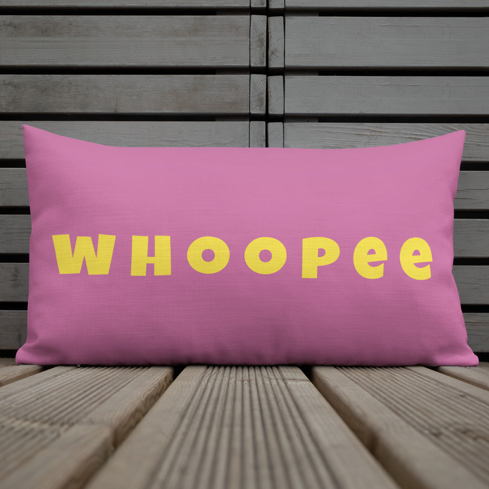 Vibrant, cheerful, and playful style accent pillow on wood deck with a fun Whoopee slogan in yellow letters on pink.