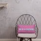 Vibrant, cheerful, and playful style accent pillow on modern chair with a fun Whoopee slogan in cyan letters on pink.