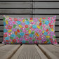 Vibrant, cheerful, and playful style accent pillow on wood deck with a multicolor graphic Popcornfroops print on front.