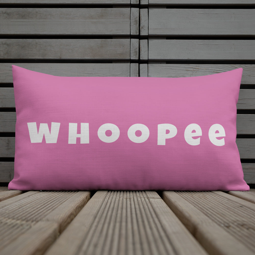 Vibrant, cheerful, and playful style accent pillow on wood deck with a fun Whoopee slogan in platinum letters on pink.