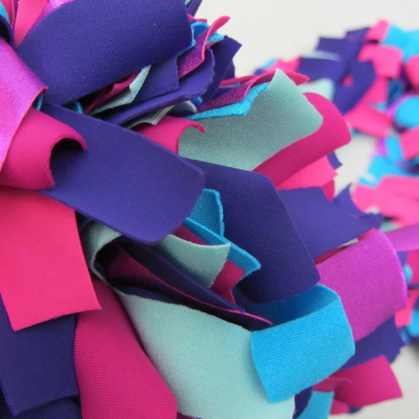 Detail of colorful and stylish soft lush fashion boa scarf in aqua, purple, pink colors limited edition Twinki-Winki view 2.