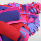 Detail of colorful and stylish soft lush fashion boa scarf in red, purple, pink colors limited edition Twinki-Winki view 2.